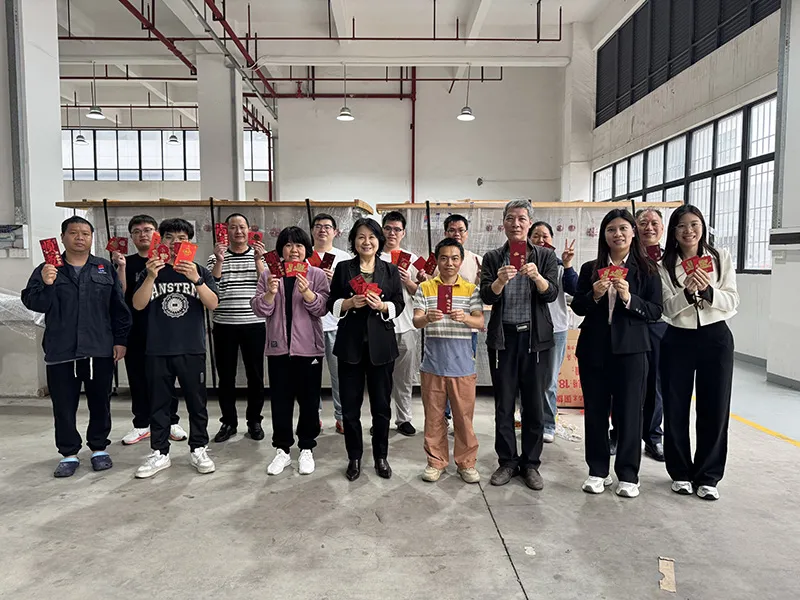 Teemyeah team members posing together in factory workshop