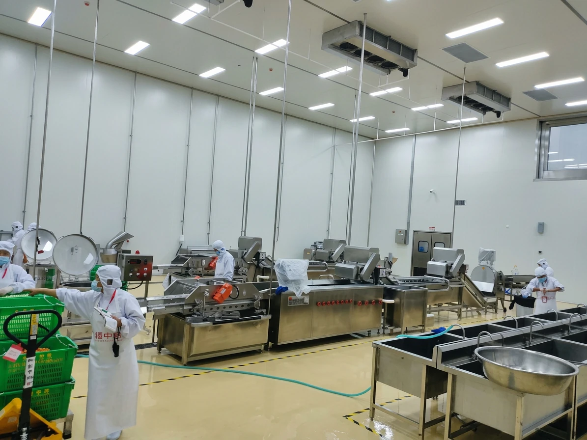 Food processing line commissioning with workers in a clean production room