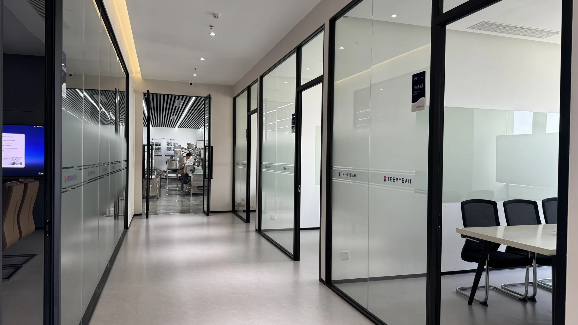 TEEMYEAH office corridor with glass meeting rooms and workspaces