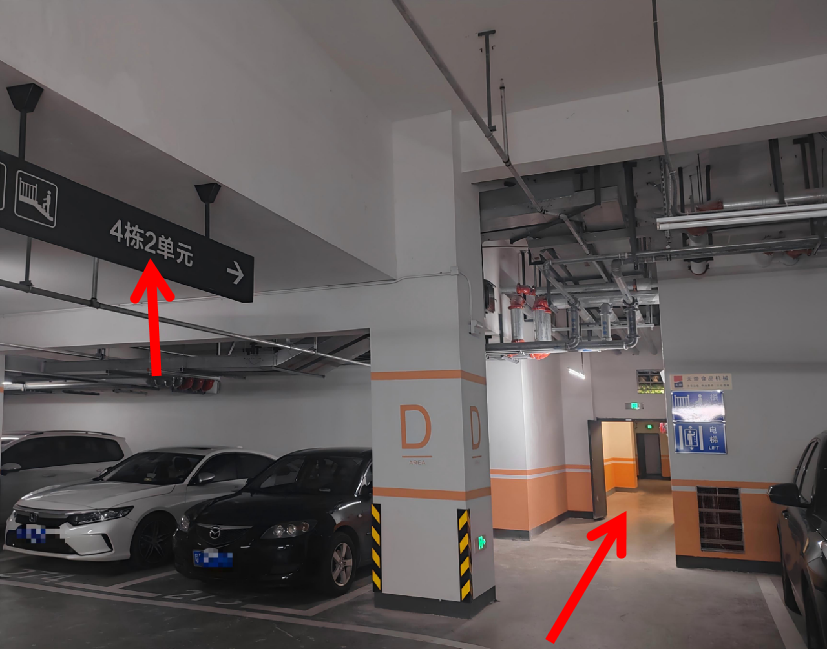Zone D underground parking sign for Building 4, Unit 2 and the nearby elevator entrance