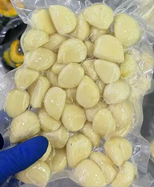 Peeled garlic cloves prepared for food processing